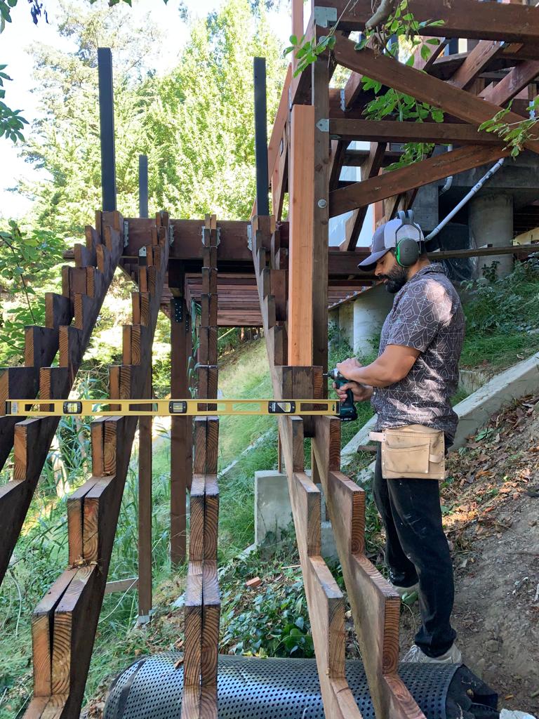 Franzoi building a wooden staircase