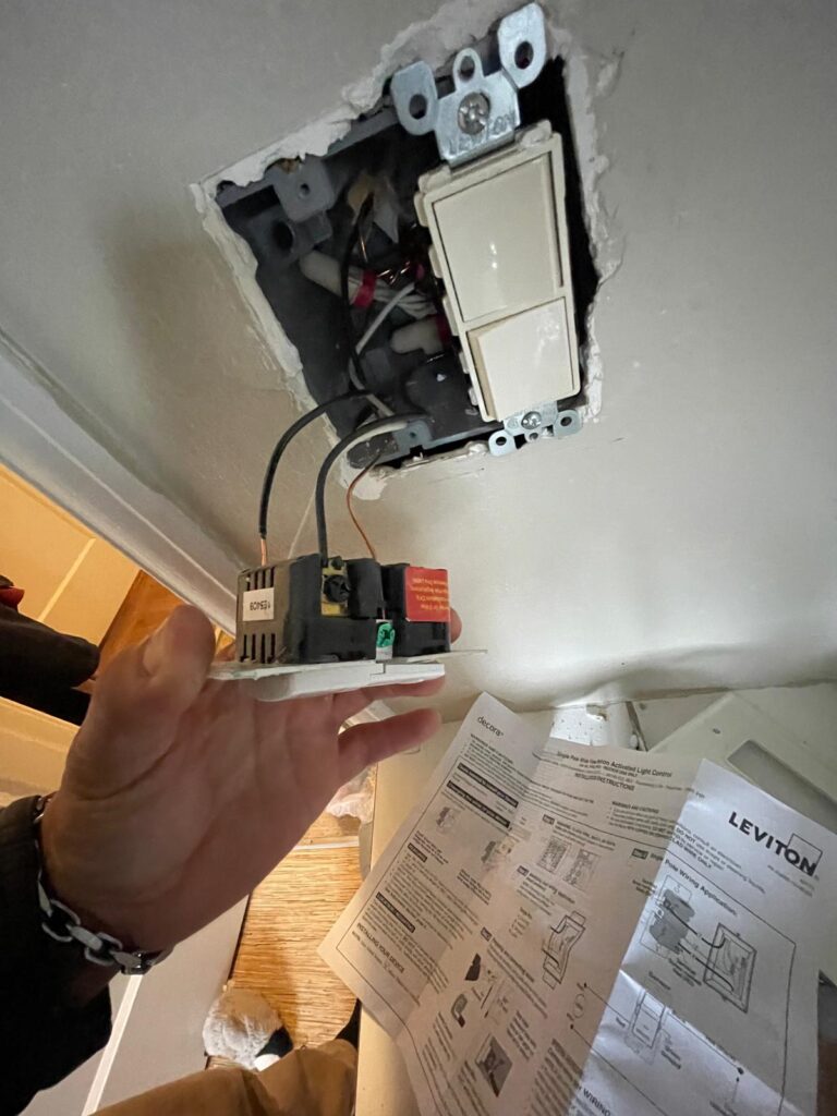Franzoi installing an electrical outlet